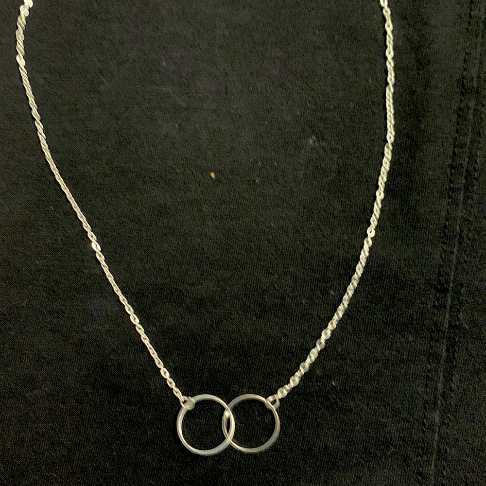 Silver choker style necklace. 14 inch chain. Lobster claw clasp.